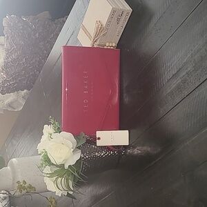 TED BAKER clutch bag Magenta in color